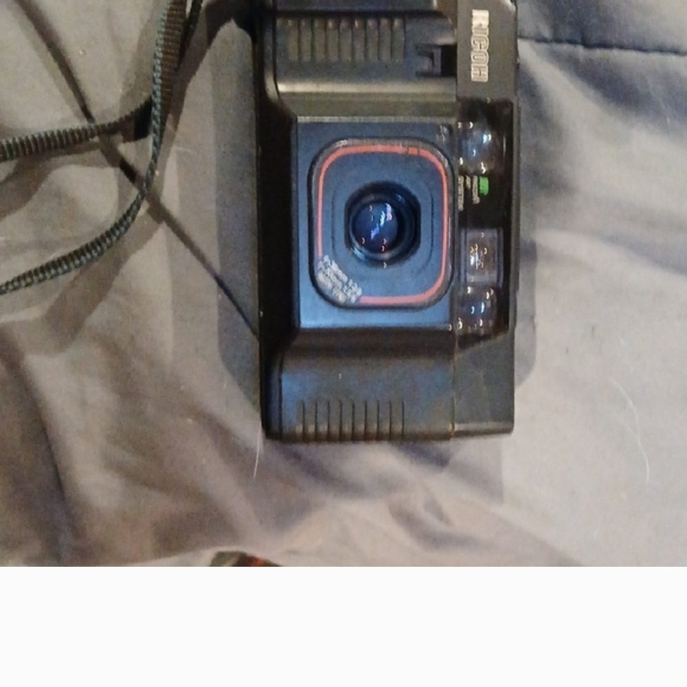 Nikon Black Film Camera with Red Accents